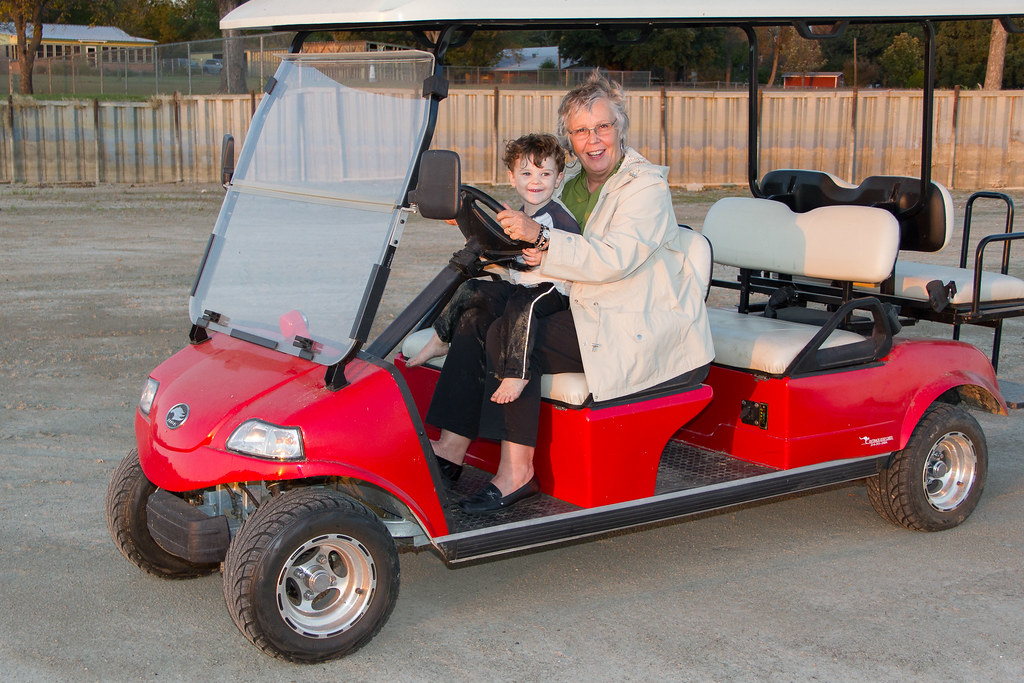 Four-passenger golf cart with a rear seat